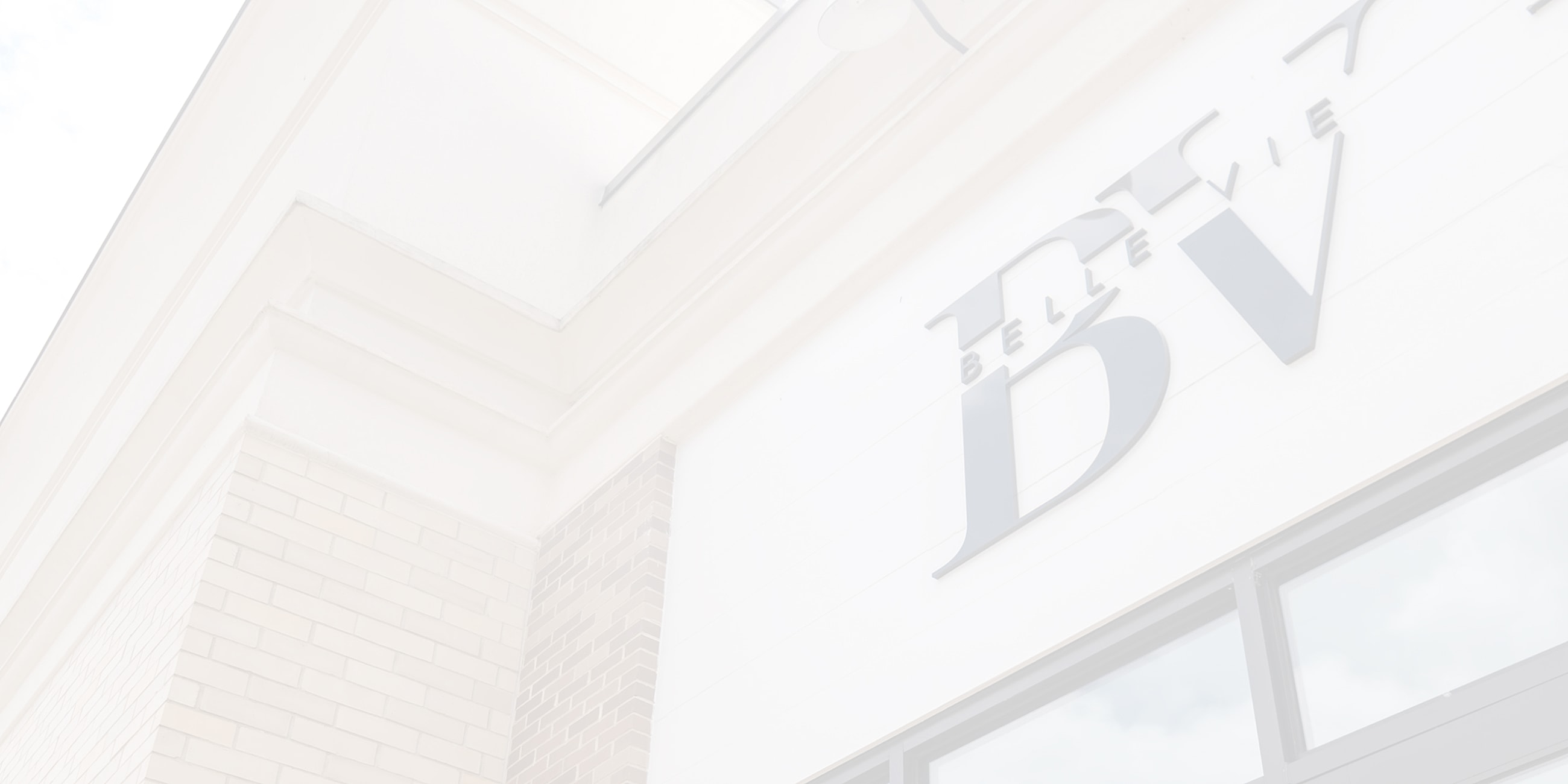 Building exterior with signage in soft lighting.