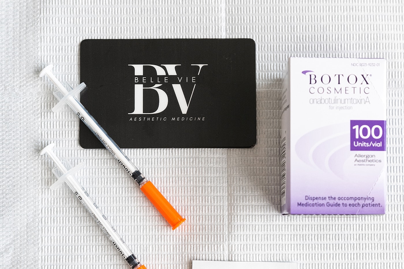 Botox syringes and aesthetic medicine branding.