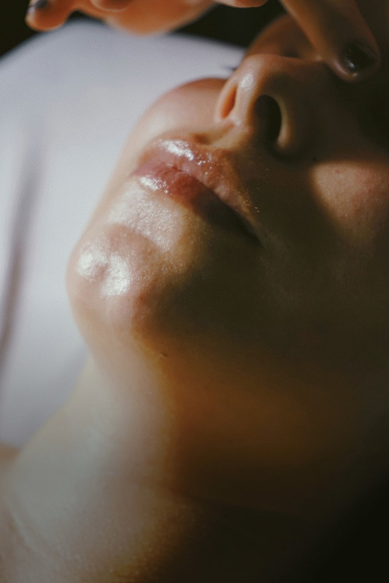 Woman receiving beauty treatment with needle.