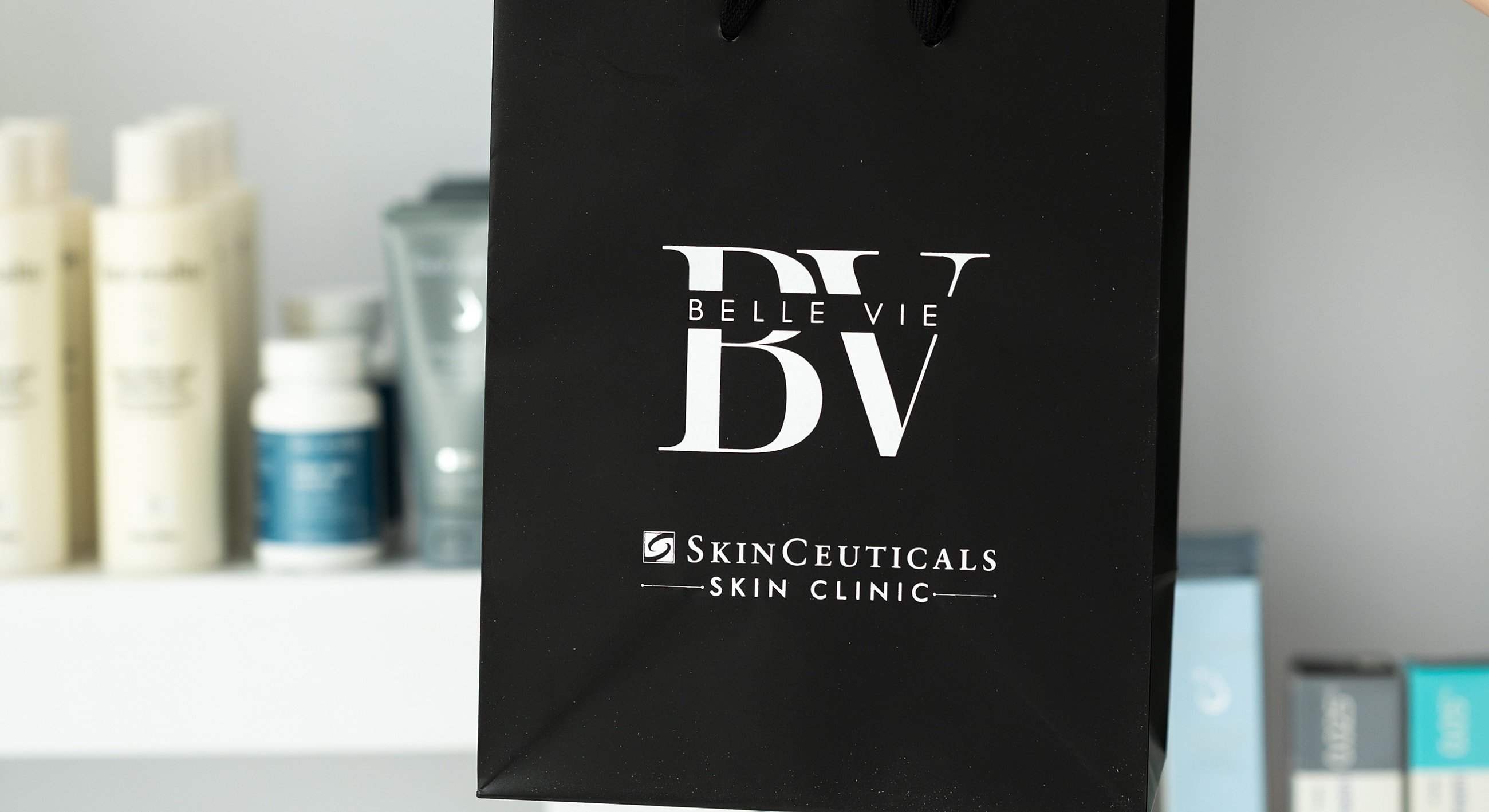 Black bag with Belle Vie and SkinCeuticals logos.