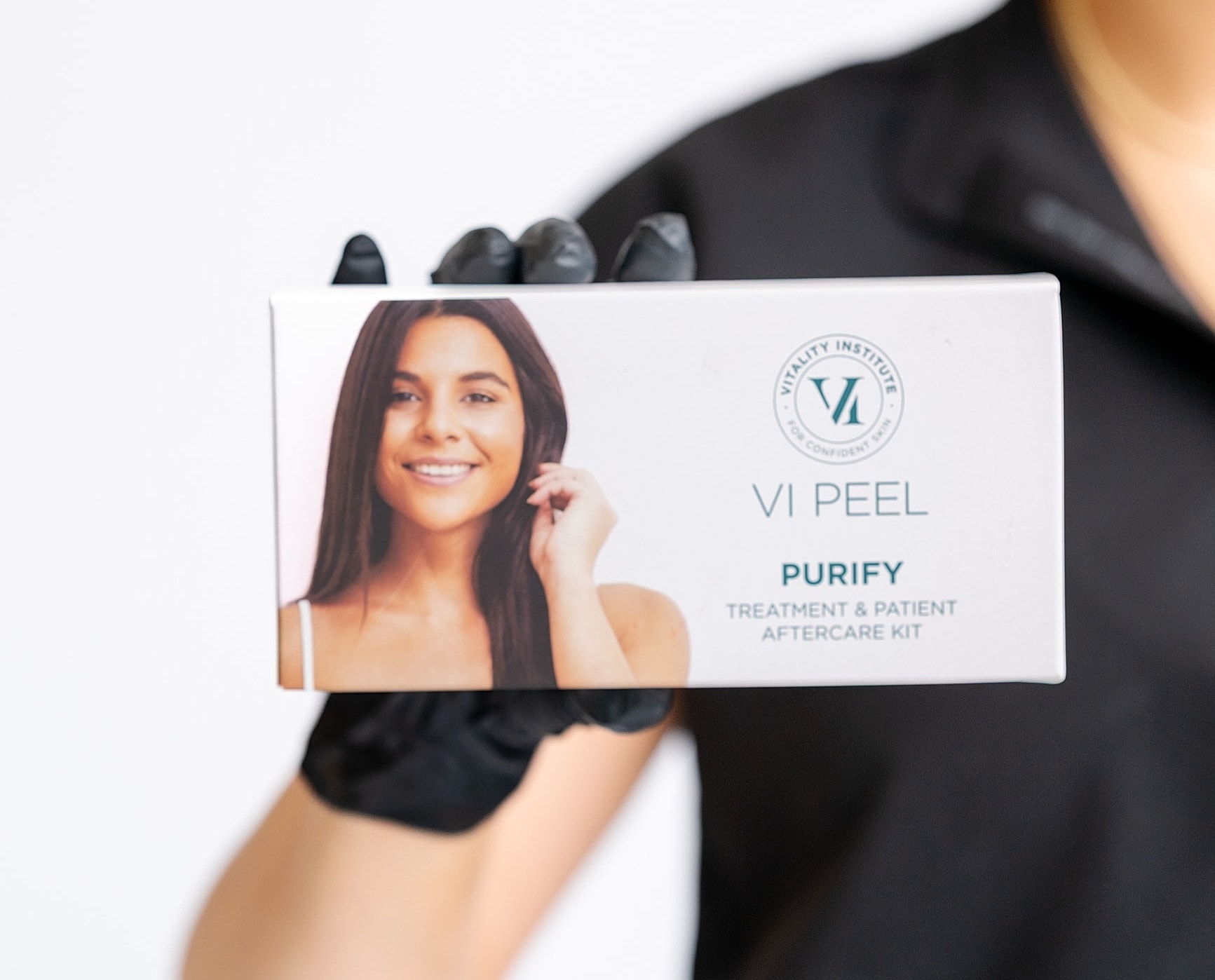 VI Peel Purify aftercare kit being held.