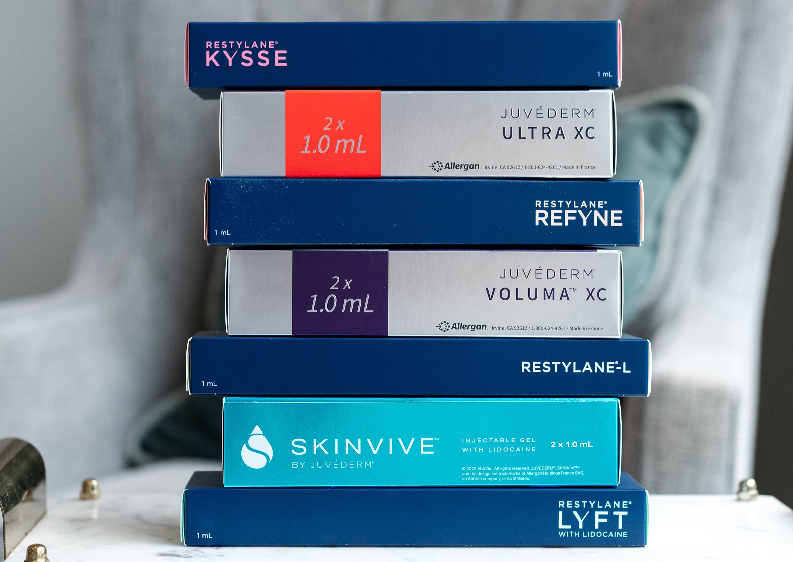 Dermal filler product boxes stacked together.