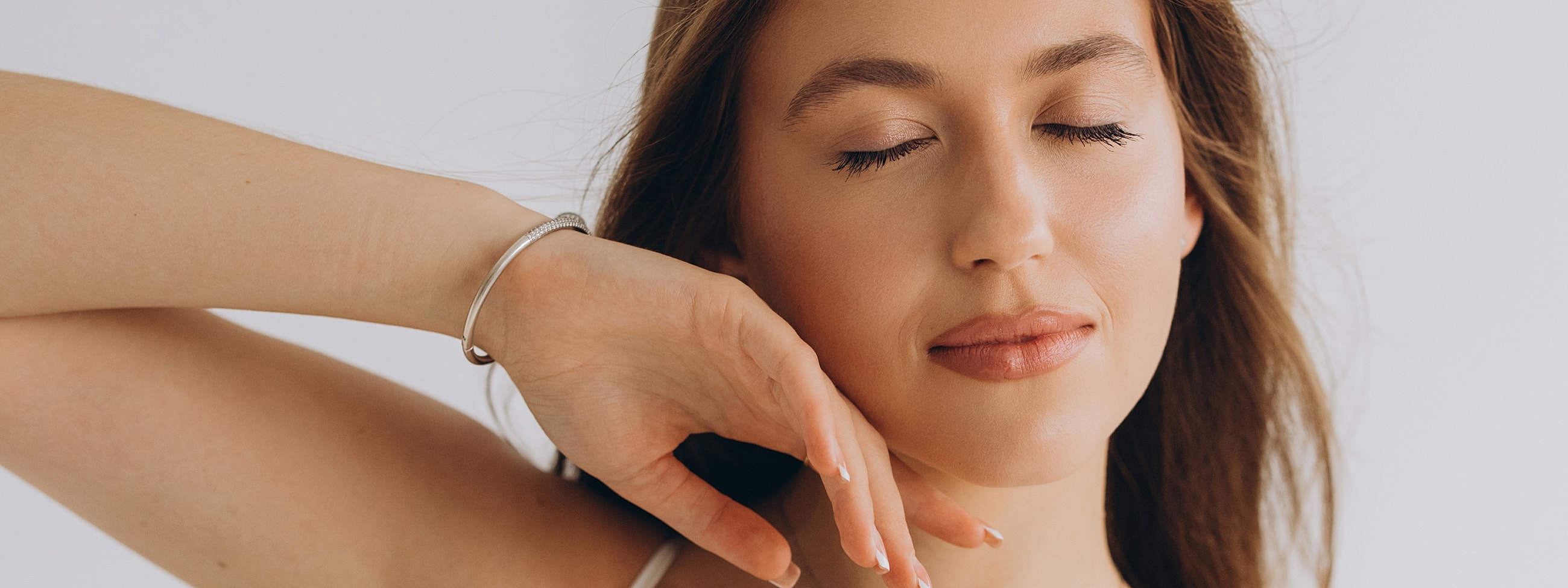 Woman with closed eyes and soft expression.